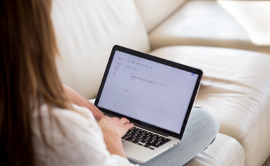 Girl Typing Cover Letter for MIT Sloan