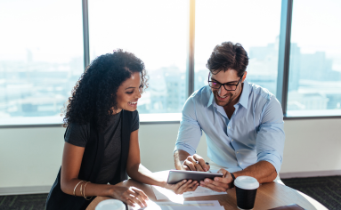Two People Reading an E-book together