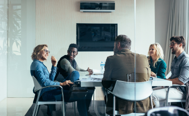 People in a conference room expanding their network circle