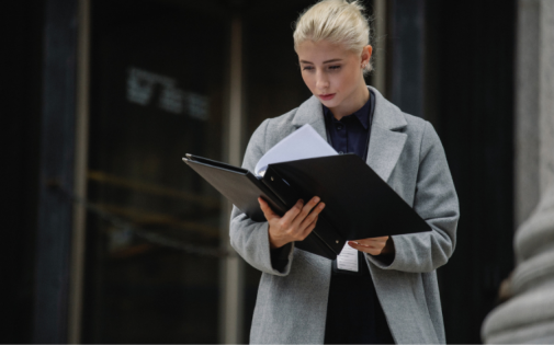 A woman consultant looks at portfolios