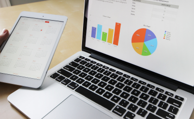 Laptop and Tablet with GMAC's 2021 Student Statistics