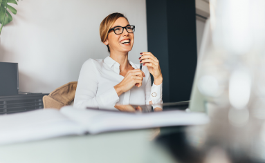 Woman Laughing in Meeting