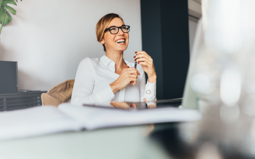 Woman Laughing in Meeting