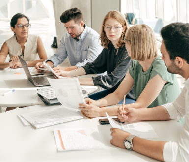 Group of People Working Together and Discussing Reasons to Get an MBA